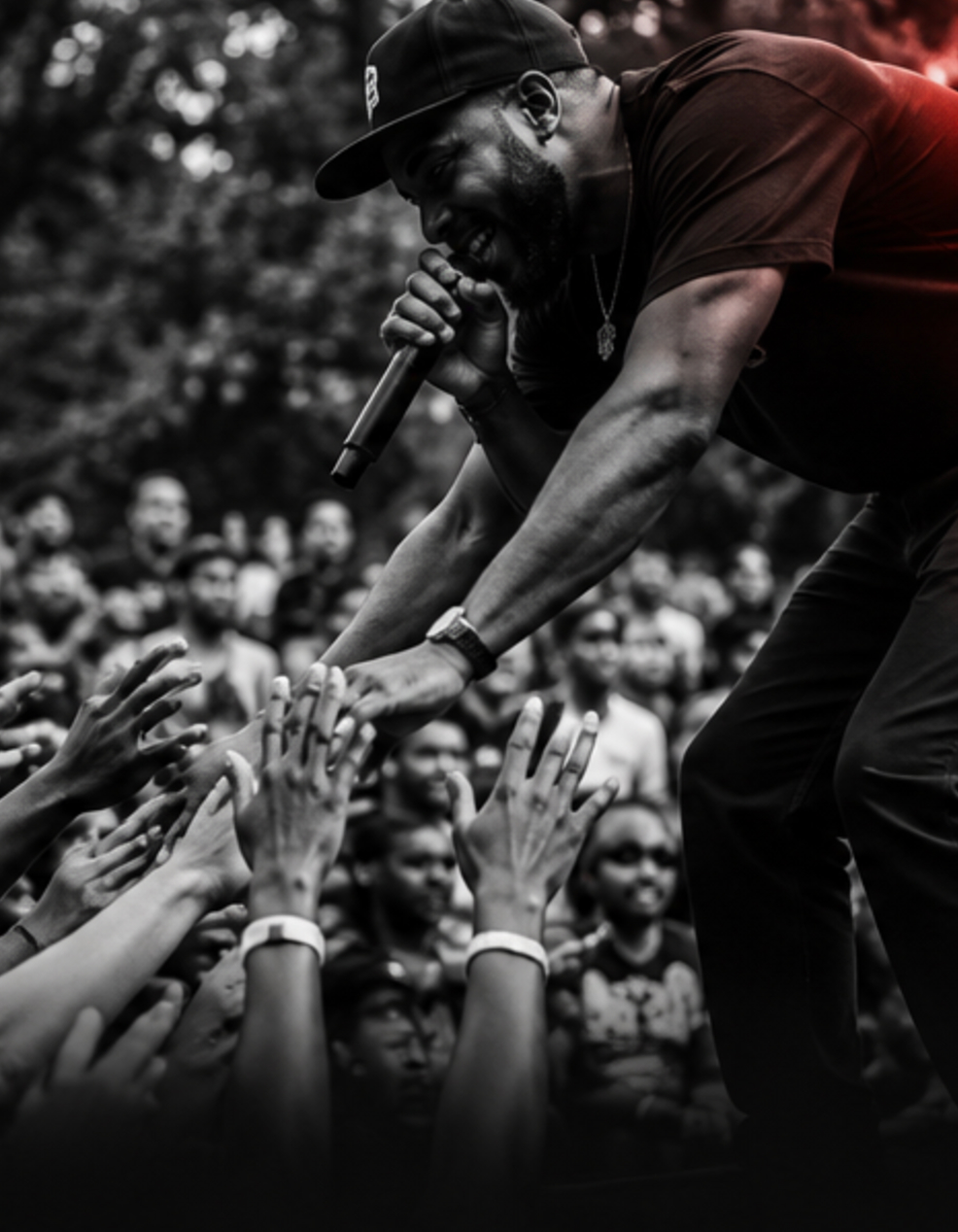 A performer reaching toward members of the audience